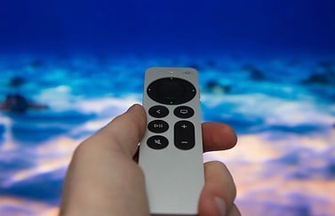 Siri Remote in hand 2