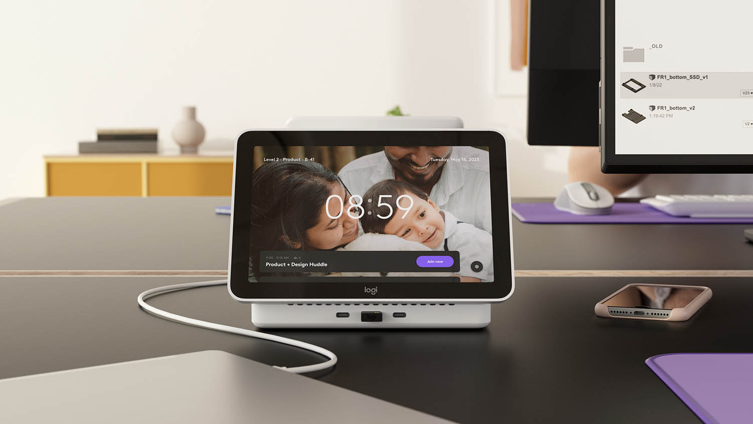 Logi Dock Flex op een bureau met babyfoto