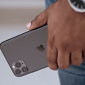 iPhone 11 Pro in hand van man